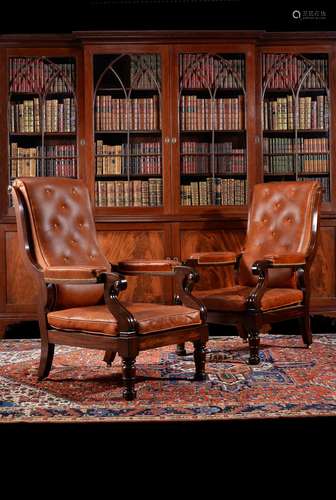 A pair of William IV mahogany and leather upholstered armchairs