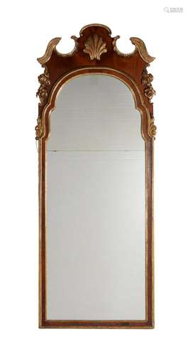 A walnut and parcel gilt wall mirror, in George II style, 19th century