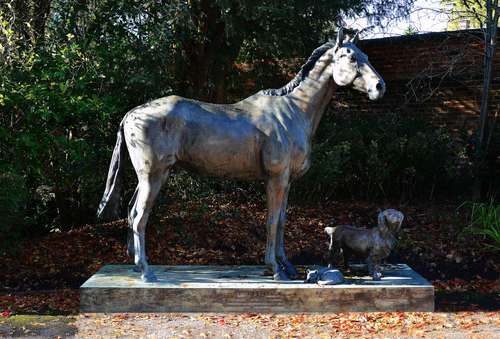 λ Caroline Wallace (British), an impressive patinated bronze model of a race horse