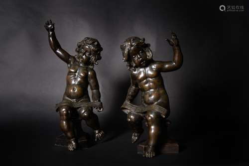 After Ferdinando Tacca, a pair of Italian patinated bronze models of musician putti