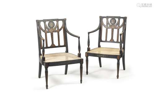 A pair of George III ebonised and painted open armchairs