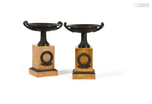 A pair of Restauration patinated bronze and Siena marble tazzas on plinths
