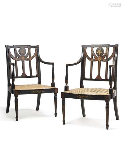 Another pair of George III ebonised and painted open armchairs