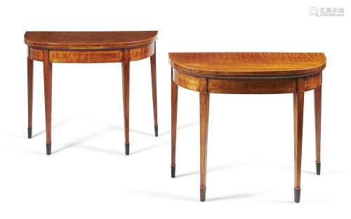 A pair of George III figured mahogany and crossbanded card tables