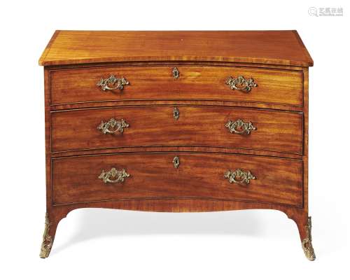 A George III mahogany concave fronted chest of drawers