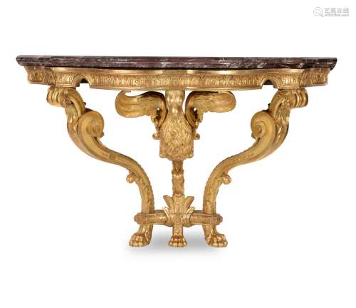 A carved giltwood serpentine console table