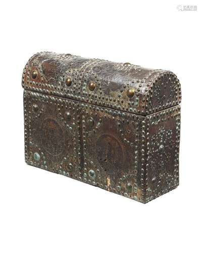 A tooled leather and brass studded trunk