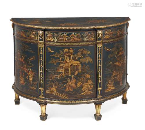 A dark green painted and gilt chinoiserie decorated demi-lune commode