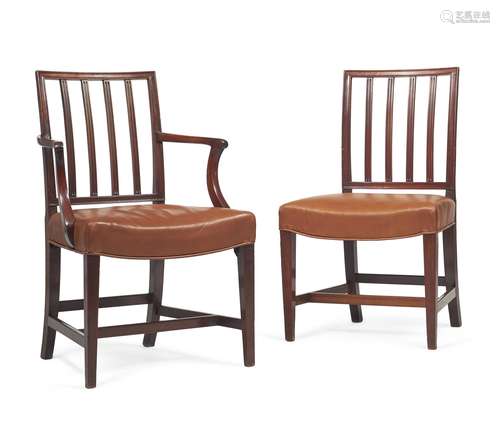 A set of fourteen George III mahogany and leather upholstered dining chairs