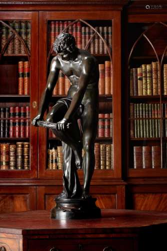 After Louis Leopold Chambard, a large patinated bronze model of a youth called 'Le Bucheron'