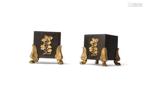 A pair of French or English parcel gilt and patinated bronze stands