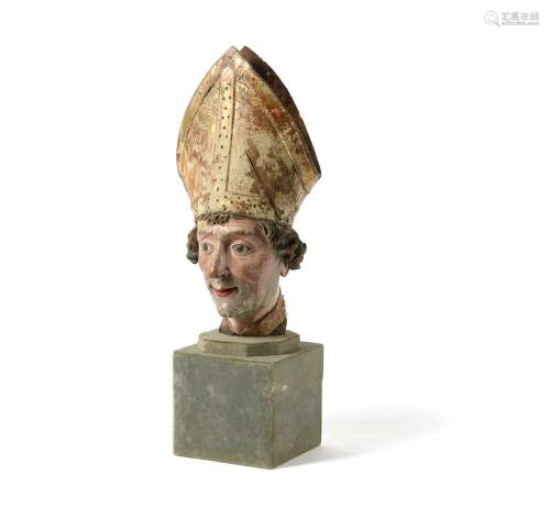 Attributed to the workshop of Hans Klocker, a carved and polychrome painted head of a Bishop Saint