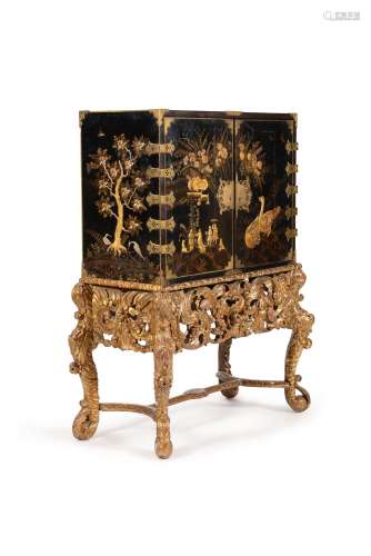 A black lacquer and gilt japanned cabinet on stand, circa 1660 and later
