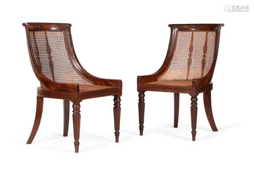 A pair of Regency mahogany library bergeres