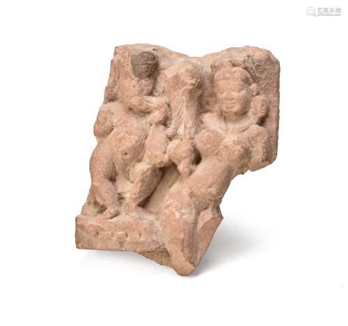 An Indian carved stone group of Ganesha and attendant