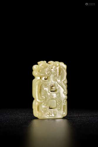 A YELLOW JADE CARVED 'KUI DRAGON' PENDANT