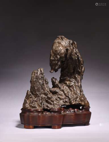 A CHINESE BLACK LINGBI SCHOLAR'S ROCK WITH STAND