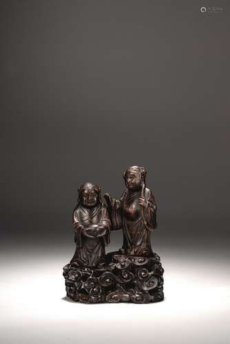 A CHINESE AGARWOOD CARVING OF HEHE ERXIAN