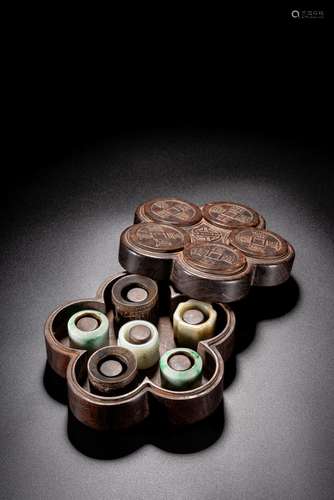 A SET OF SIX VARIOUS ARCHER'S RINGS WITH BOX