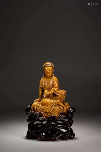 A CHINESE SOAPSTONE CARVING OF SEATED GUANYIN