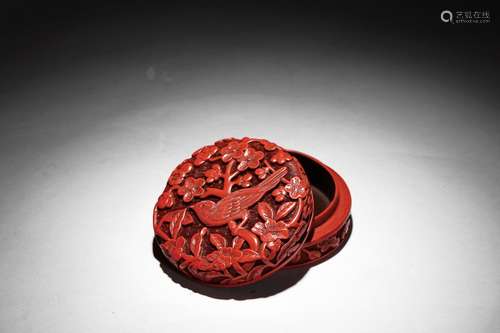 A CINNABAR LACQUER CARVED CIRCULAR BOX AND COVER