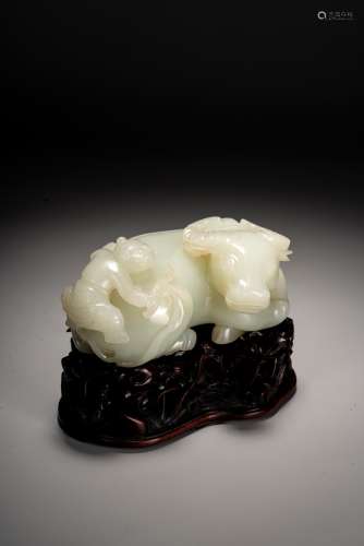 A CHINESE WHITE JADE CARVED BUFFALO AND BOY