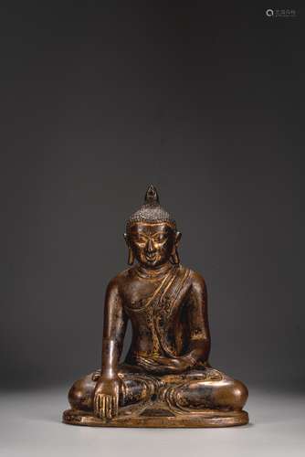 A GILT COPPER FIGURE OF SHAKYAMUNI