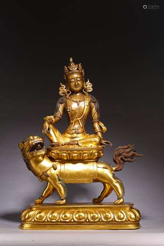 A LARGE GILT-BRONZE FIGURE OF MANJUSHRI ON LION