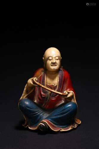 A CHINESE SHOUSHAN STONE PAINTED ARHAT FIGURE