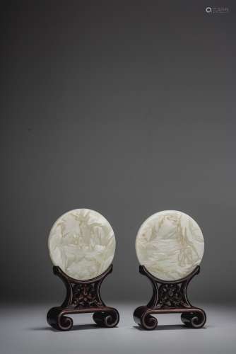 A PAIR OF SMALL WHITE JADE CIRCULAR PLAQUES