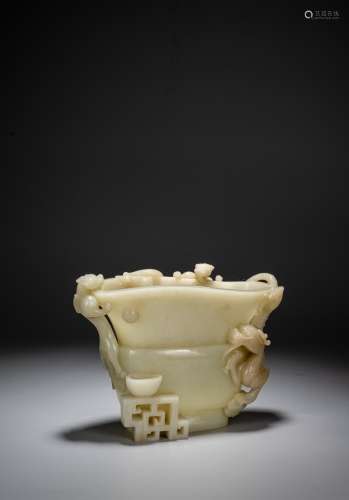 A WHITE JADE CARVED ARCHAISTIC 'DRAGON' CUP, GUANG