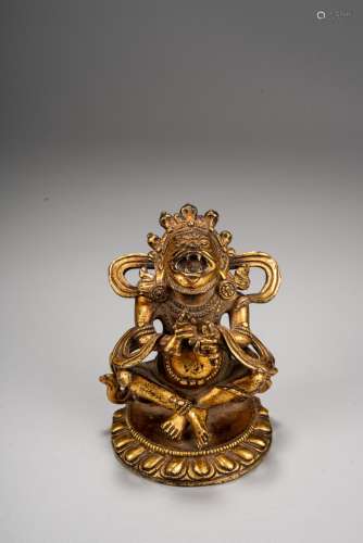 A TIBETAN GILT BRONZE OF DEITY