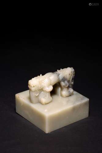 A CHINESE CELADON JADE CARVED 'DRAGON' SEAL