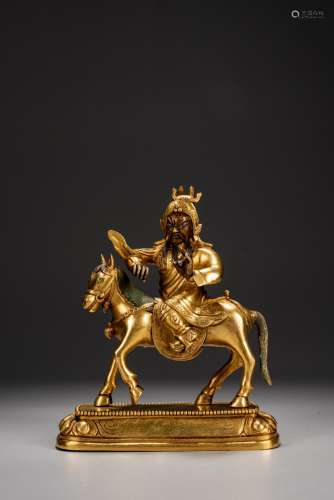 A CHINESE GILT BRONZE FIGURE OF GUANGONG ON HORSE