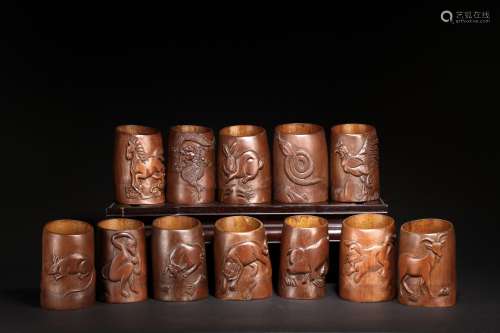 A SET OF 12 BAMBOO CARVED ZODIAC ANIMAL BRUSHPOTS