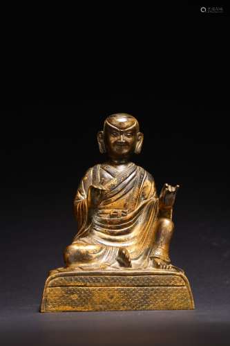 A GILT BRONZE FIGURE OF TIBETAN GURU