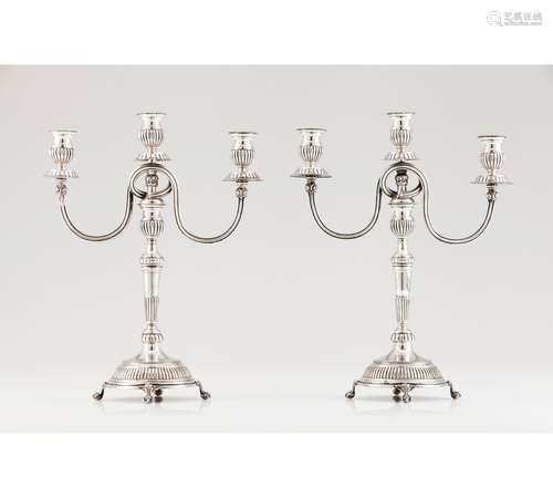 A pair of three branch candelabra