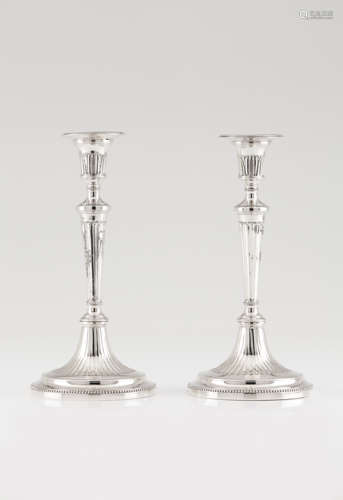 A pair of neoclassical candle sticks