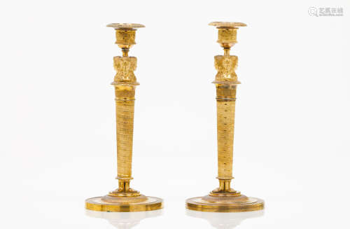 A pair of candle sticks in the manner of Claude Galle (1759-1815)