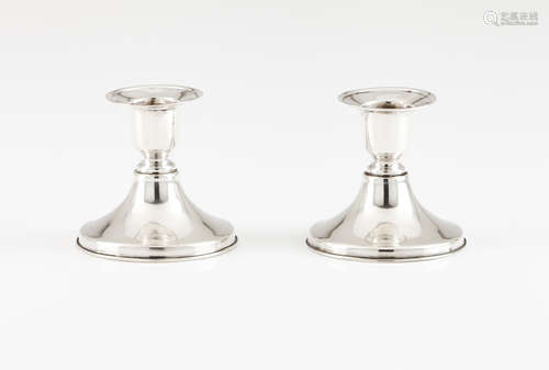 A pair of piano candlesticks