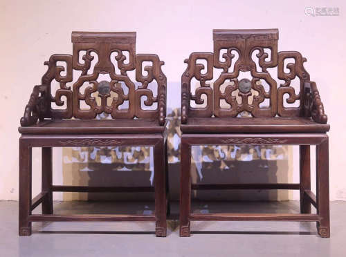 A ZUOMU WOOD CARVED CHAIR