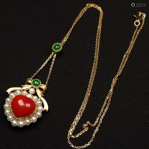 A 18K GOLD AND CORAL PENDANT WITH CHAIN