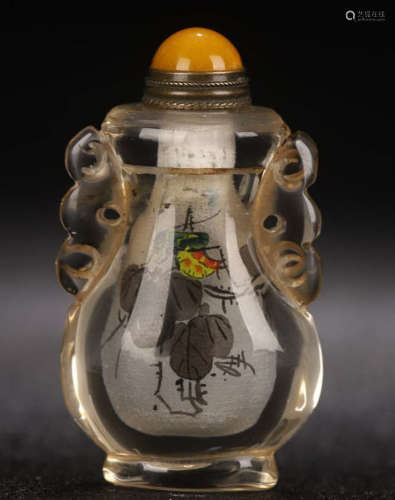 A CRYSTAL CARVED SNUFF BOTTLE