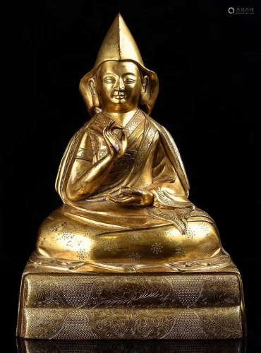 A GILT BRONZE CASTED TSONGKAHAPA STATUE