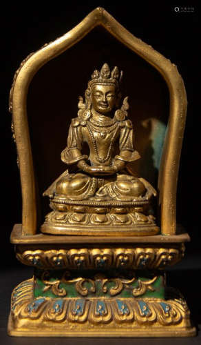 A GILT BRONZE BUDDHA WITH PAGODA