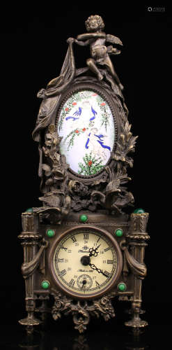 A COPPER WITH GEM STONE CASTED CLOCK