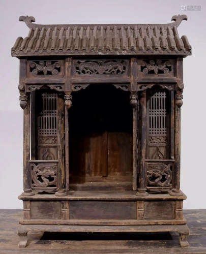 A YUMU WOOD CARVED PAGODA