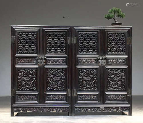 A HEITAN WOOD CARVED CABINET