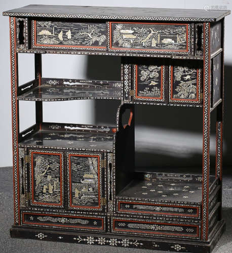 A LACQUER CABINET EMBEDDED WITH CONCH