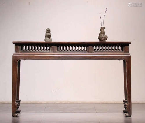 A HUALI WOOD CARVED TABLE